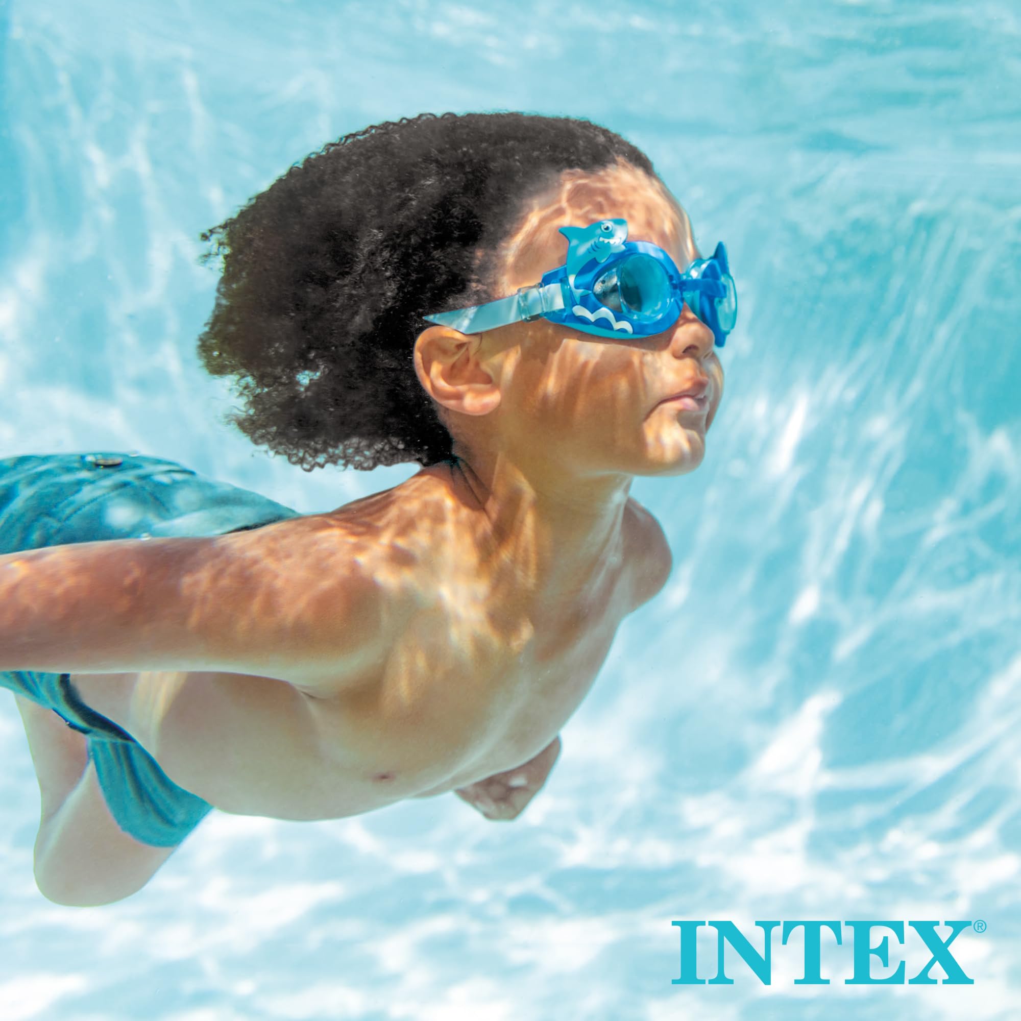 Intex brand lifestyle photo of a boy swimming underwater wearing shark goggles