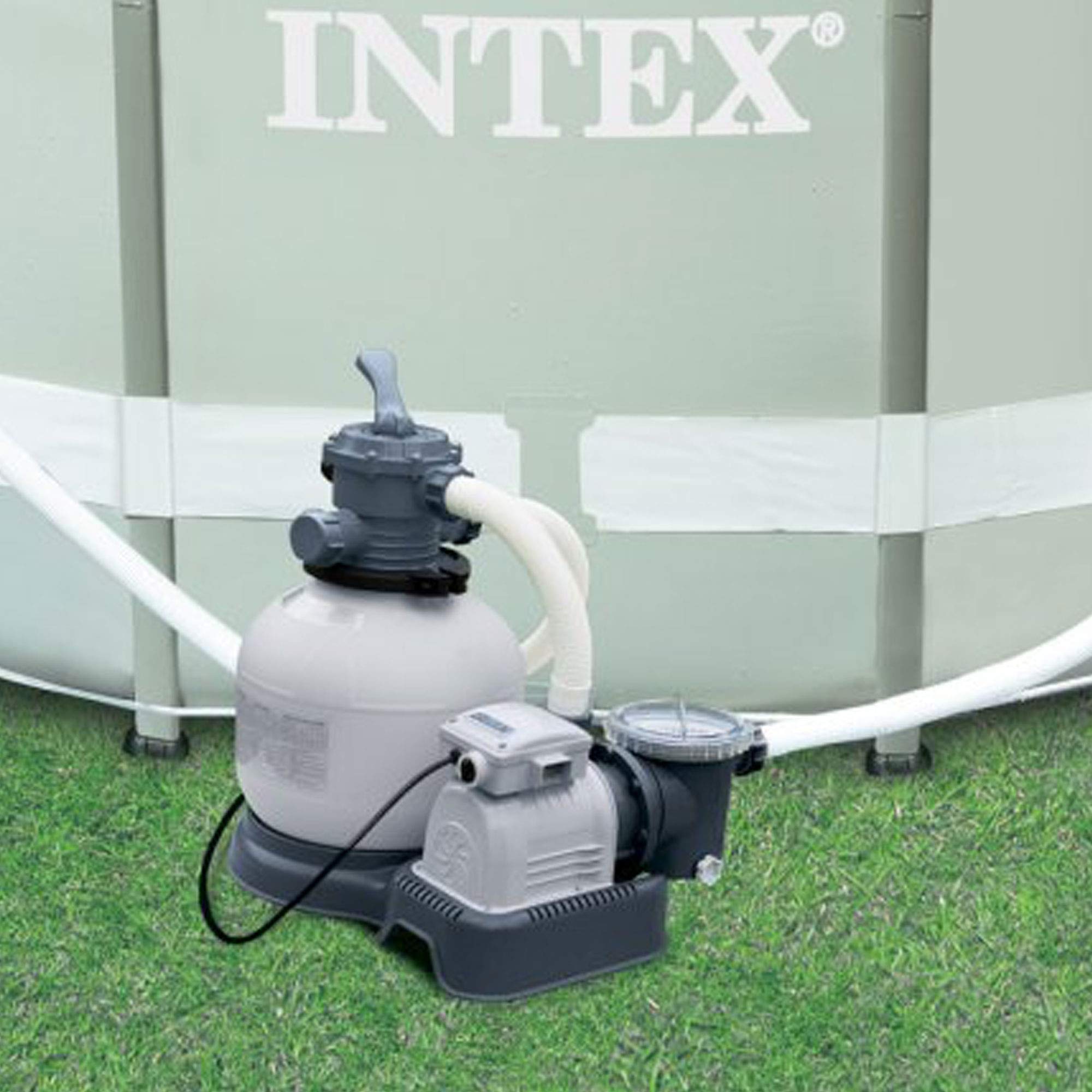 Intex 2800 GPH sand filter pump set up beside an Intex above-ground metal frame pool