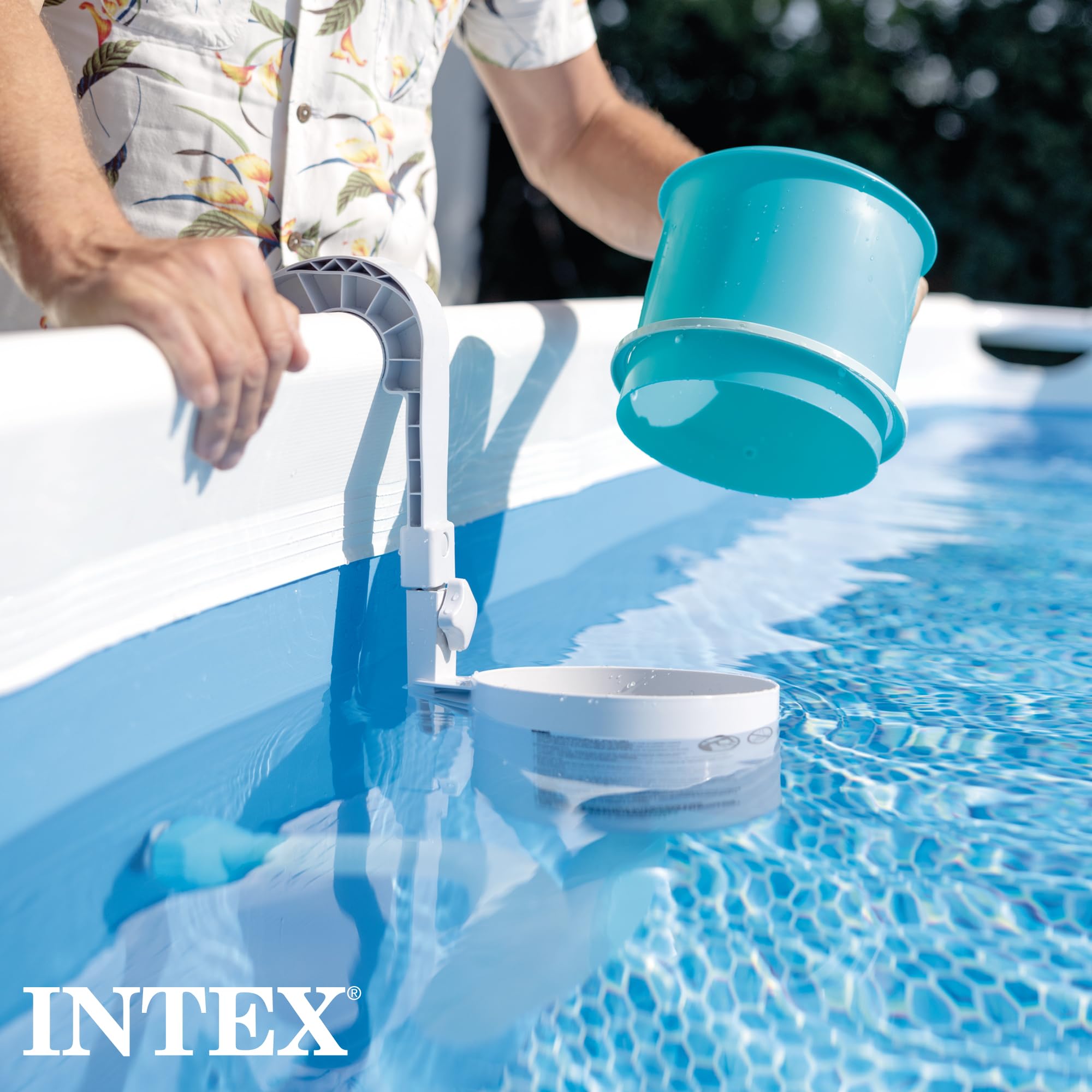 Man lifting the strainer basket out of the Intex wall-mounted skimmer on an above-ground pool