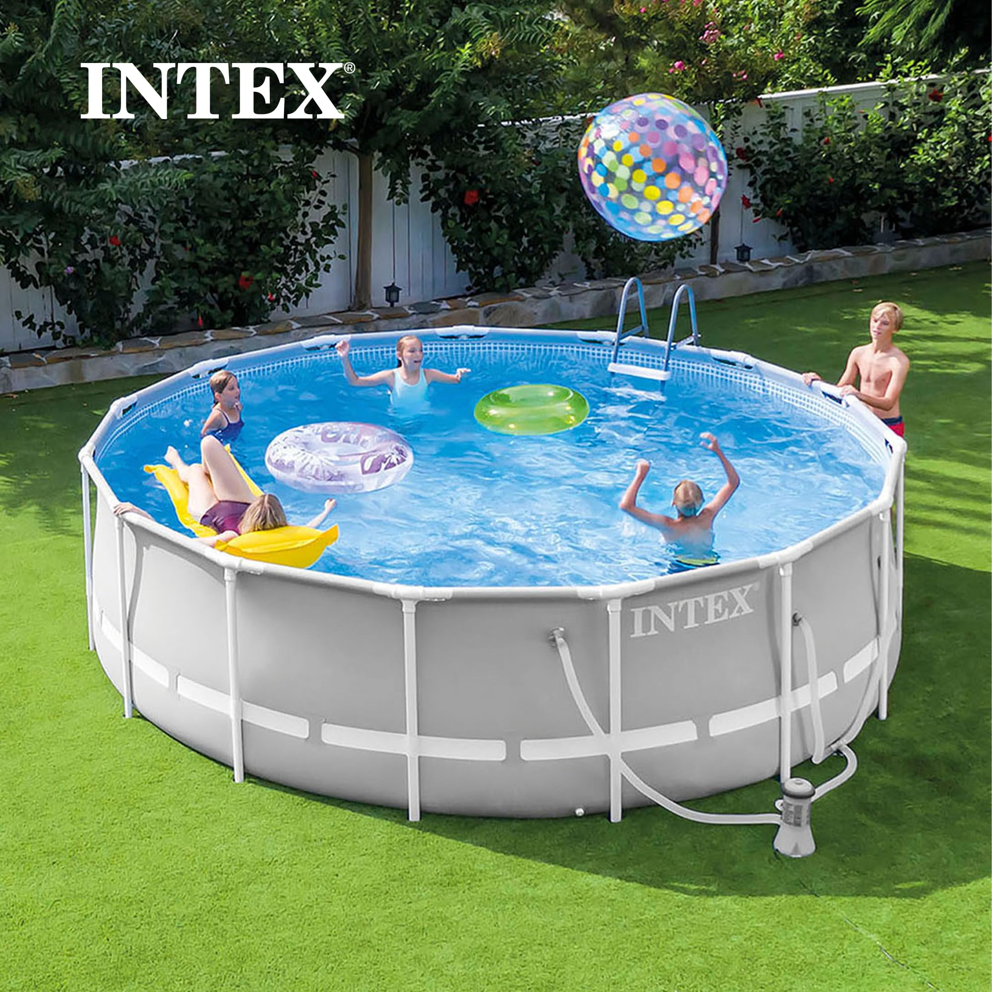 Intex Prism Frame round above-ground pool in a backyard with a family playing with pool floats and a beach ball
